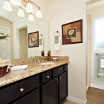 Striking cabinets and marble counter tops will brighten the start to your day.